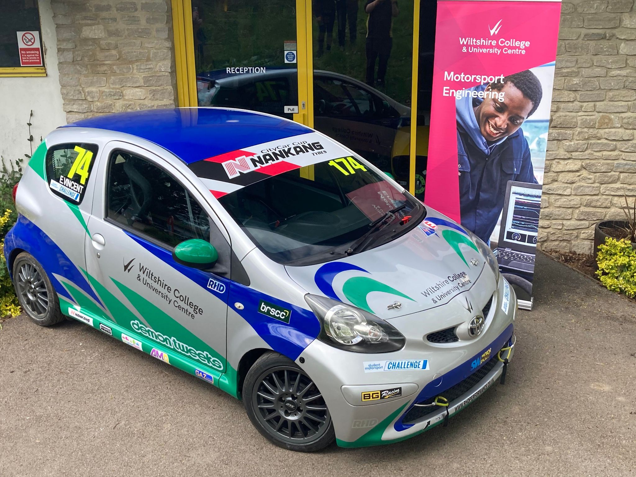 Wiltshire College Toyota Aygo outside their campus building at Castle Combe Race Circuit